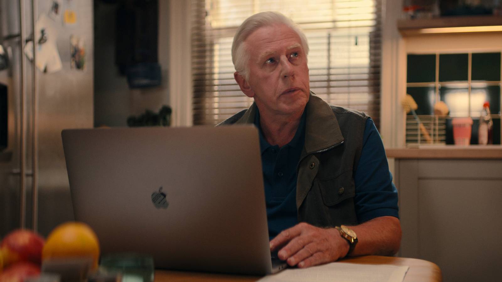 Phil Davis as Vic sitting in front of a MacBook in Apple TV's Trying season 4
