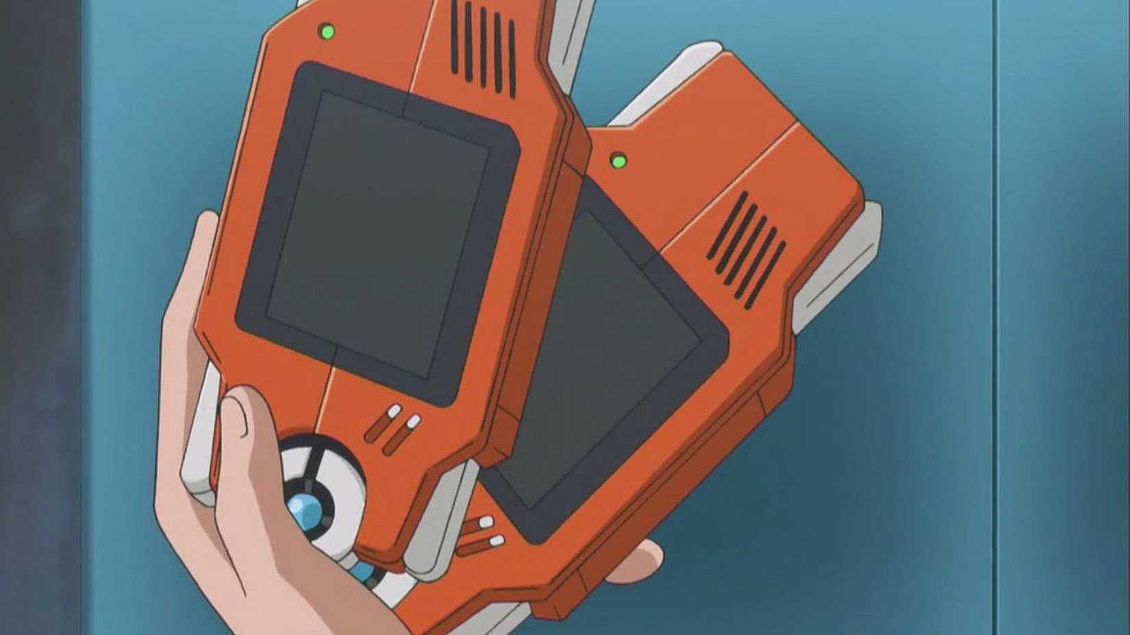 A hand holding two Pokdexes in Pokemon.