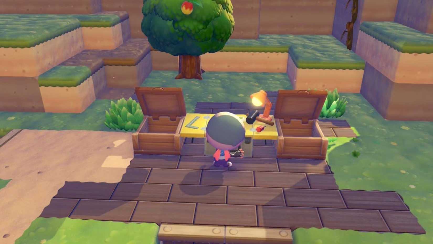 Pokemon Pokopia player character building at a worktable