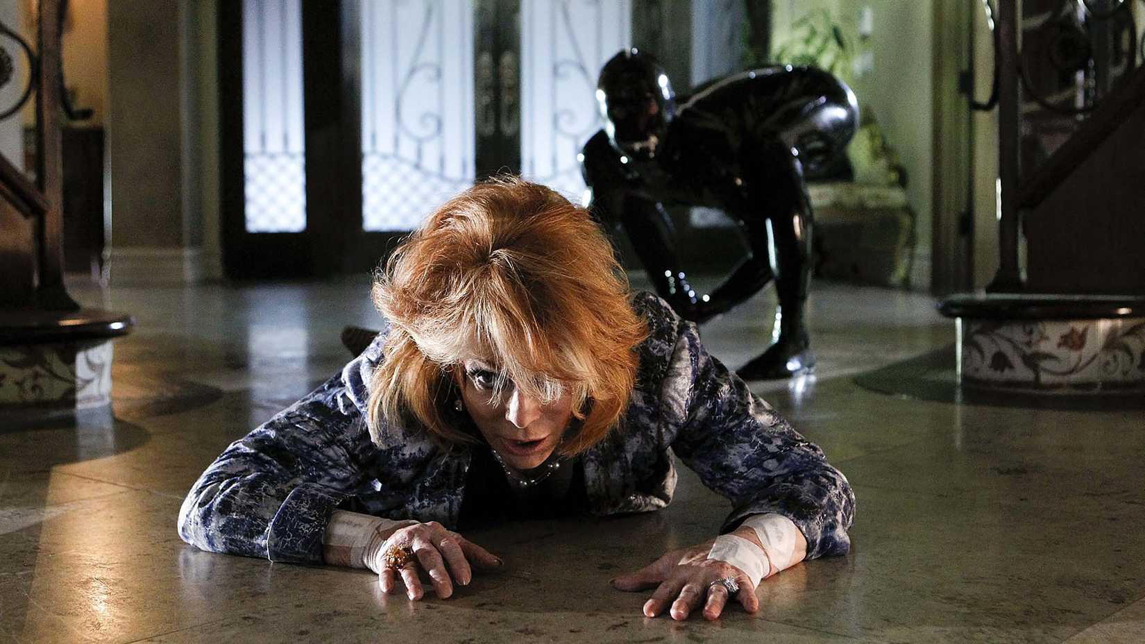 Still of a woman crawling away from Sqweegel in CSI season 11 episode 4, "Sqweegel".