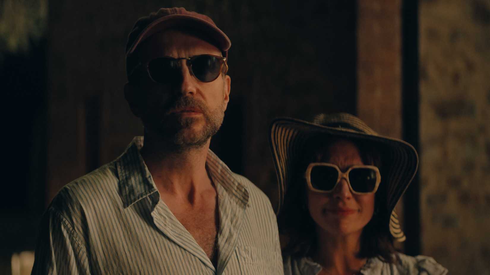 Rafe Spall and Esther Smith as Jason and Nikki wearing sunglasses at night in Trying season 5 on Apple TV