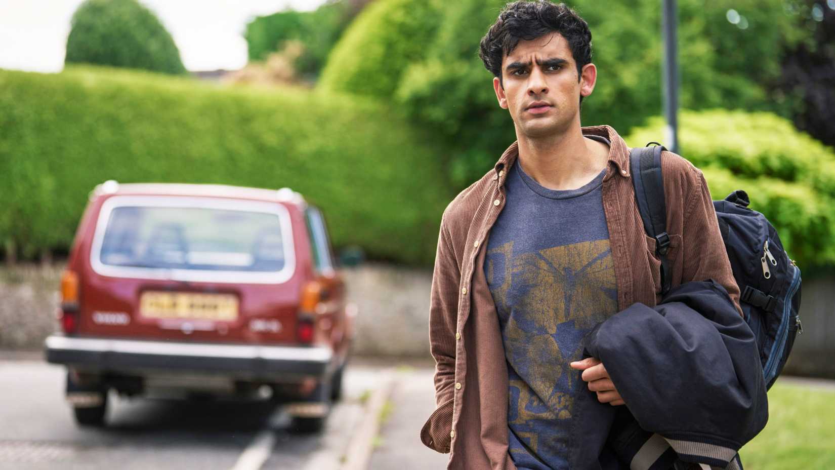 Ravi Singh (Zain Iqbal) by the side of the road in A Good Girl's Guide to Murder season 1