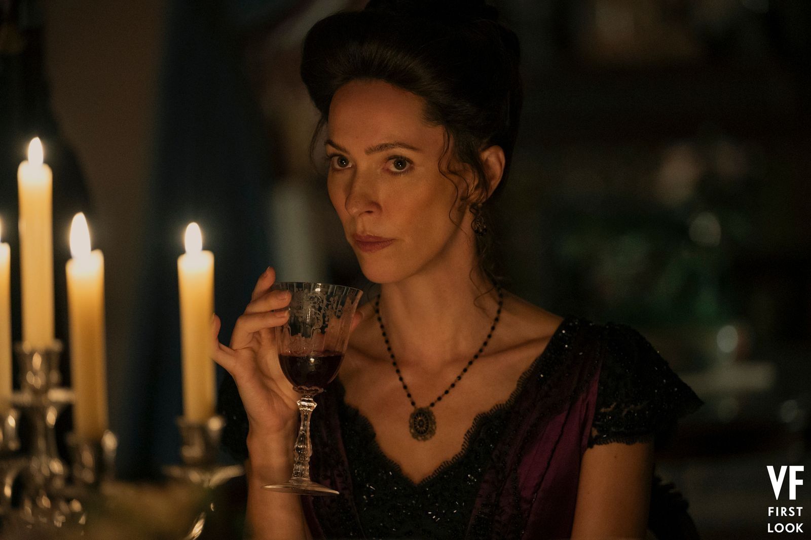 Rebecca Hall as Abby Borden, holding a drink