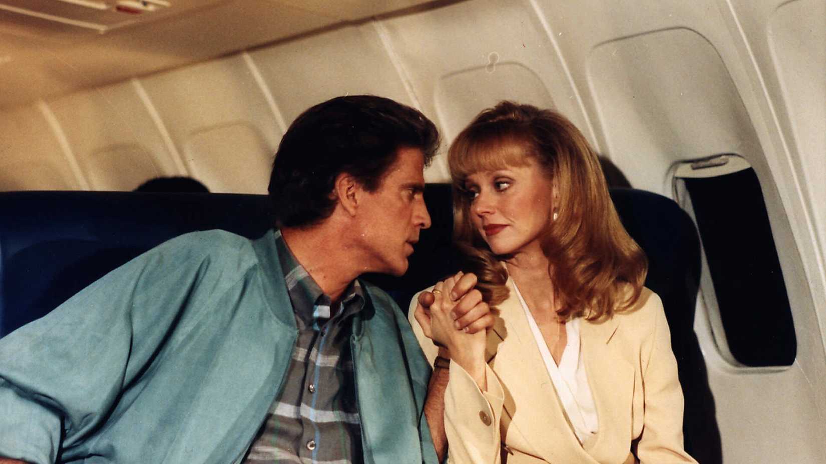 Sam and Diane on a plane in the Cheers finale