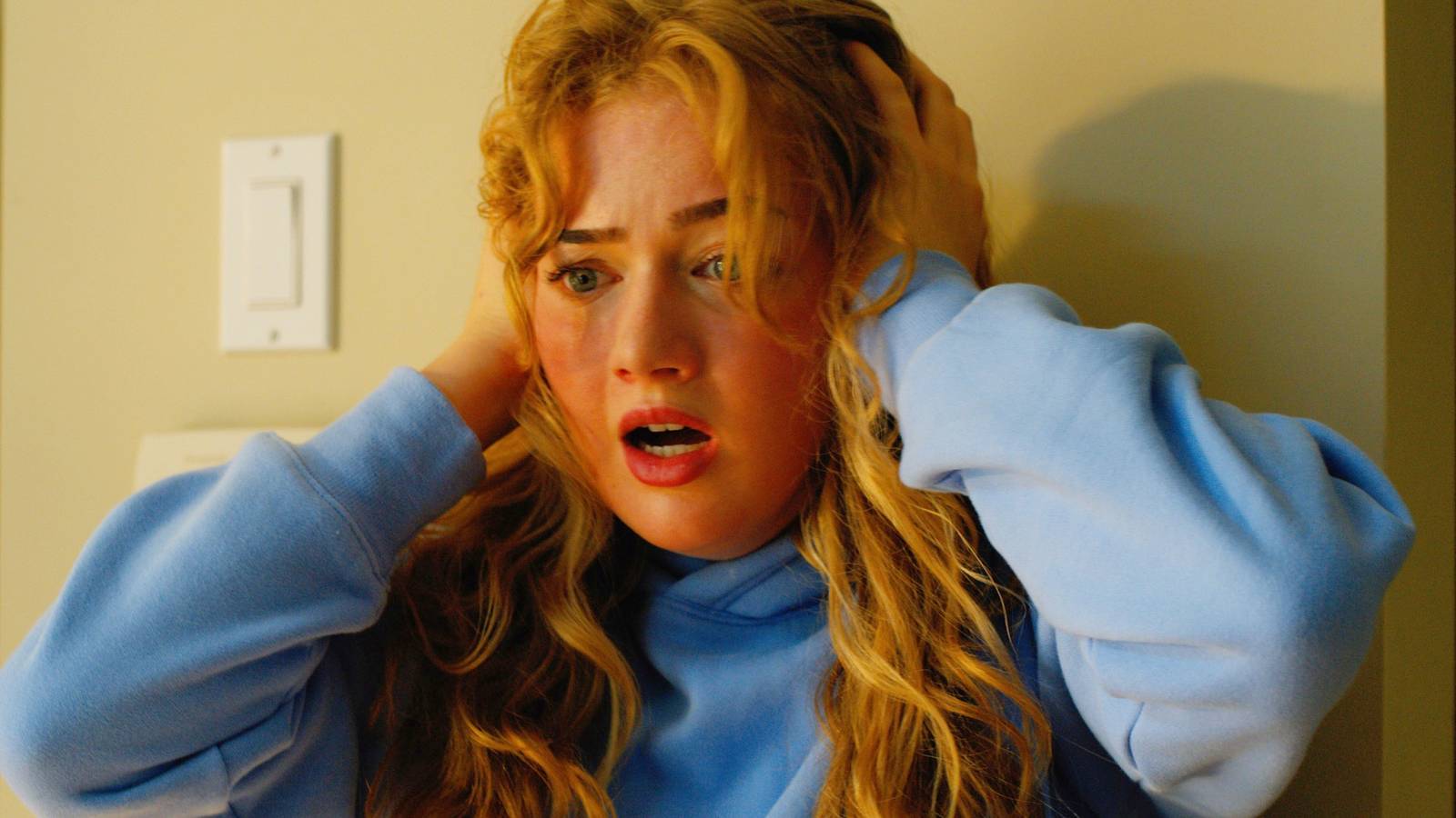 Sarah Abbott clutching her head and looking frightened in Ice Cream Man 2026