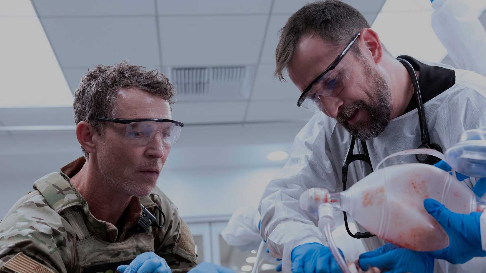 Abbot (Shawn Hatosy) and Robby (Noah Wyle) work on a patient in The Pitt-1