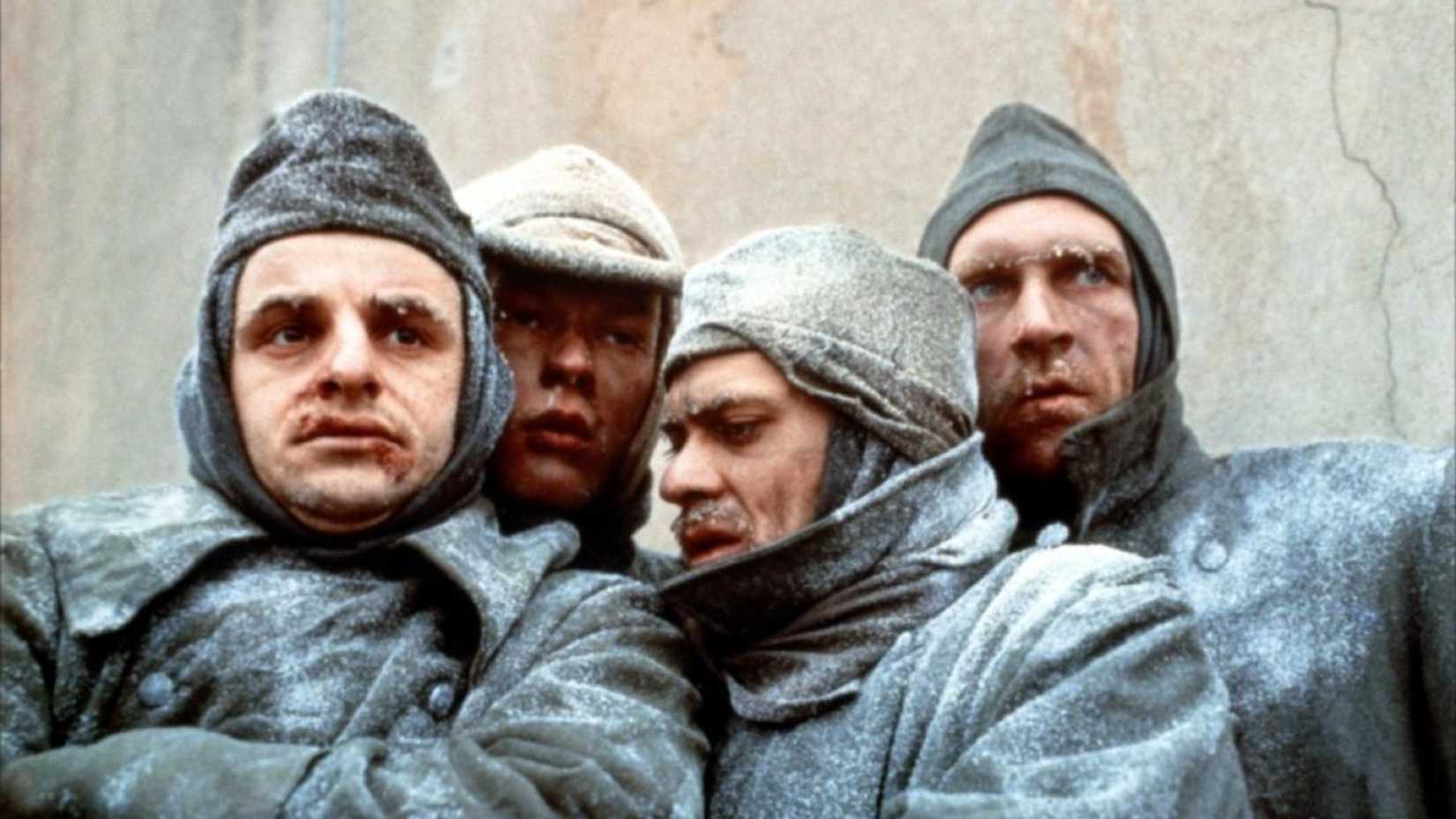 Four soldiers huddle together in Stalingrad