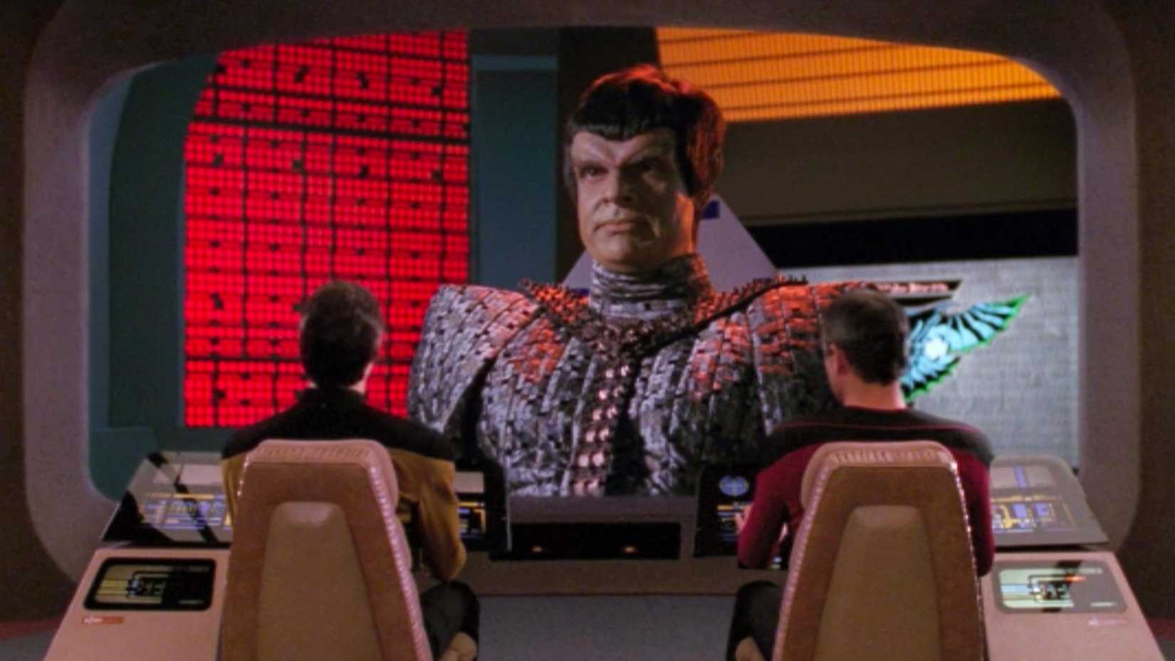A Romulan appears on the viewscreen in Star Trek The Next Generation