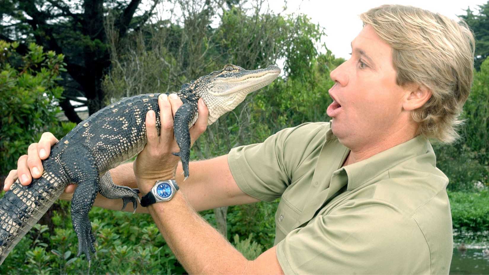 Steve Irwin holding a crocodile