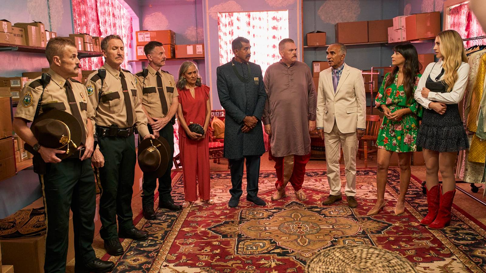 The Super Troopers 3 cast all standing on a carpet