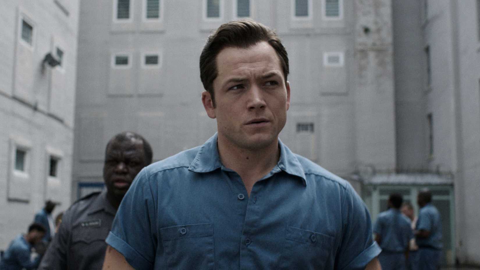 Jimmy Keene walks outside of a prison in Apple TV's Black Bird