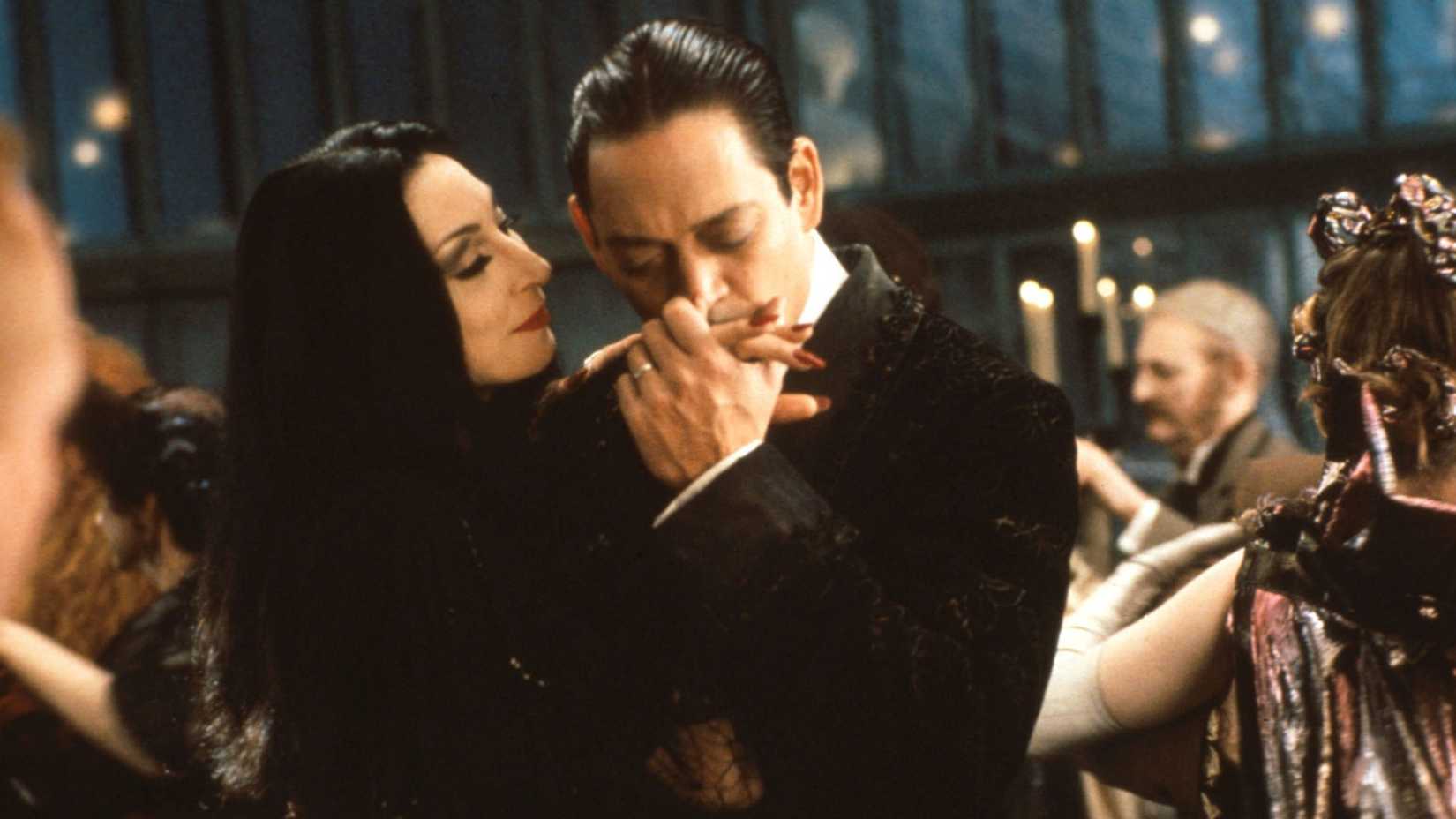 Gomez kisses Morticia's hand in The Addams Family