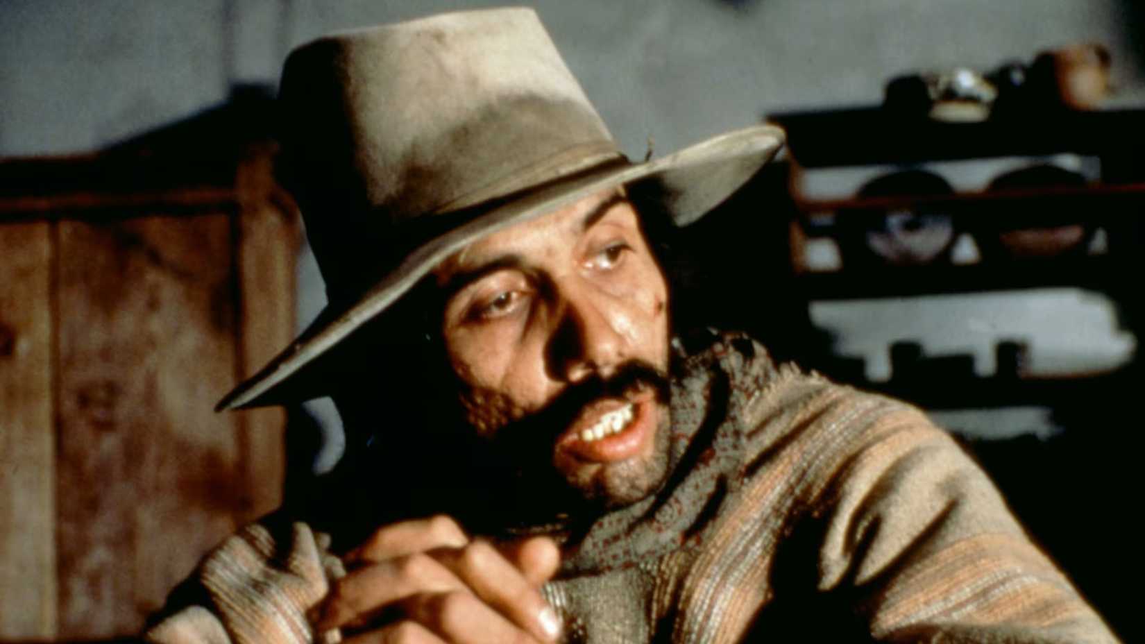 Gregorio sits at a table in The Ballad of Gregorio Cortez