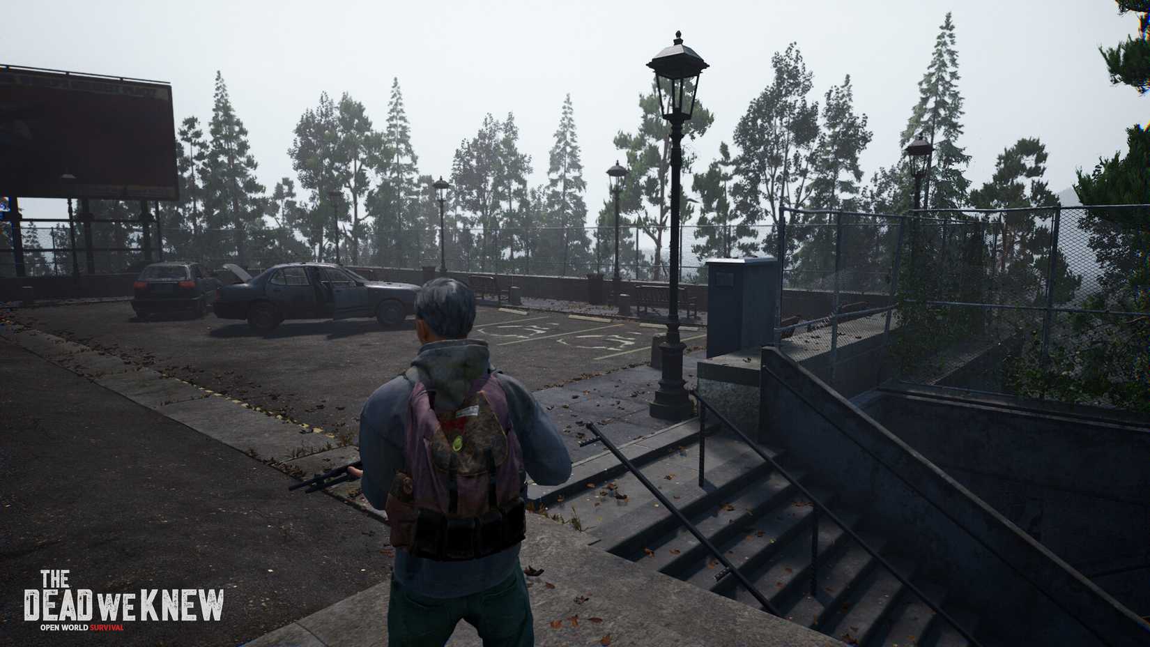 A survivor walks through an empty parking lot in The Dead We Knew.