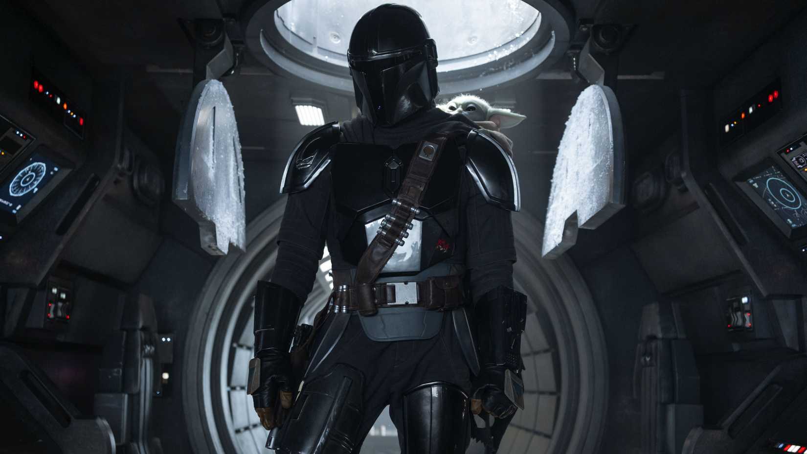 The Mandalorian and Grogu inside of a vehicle