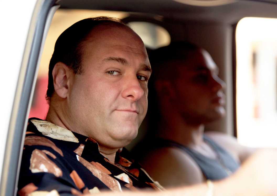 Tony (James Gandolfini) looking out a car window with someone driving him in The Sopranos.