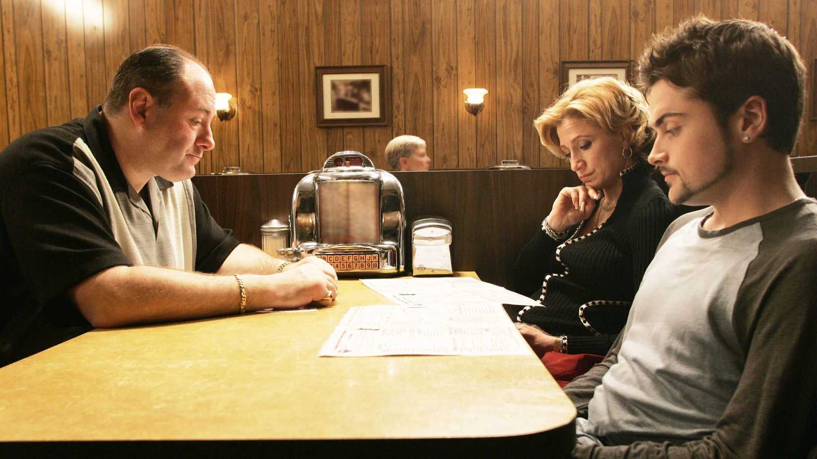 Tony (James Gandolfini), Carmela (Edie Falco), and A.J. (Robert Iler) sit at a diner table in The Sopranos, Made in America.