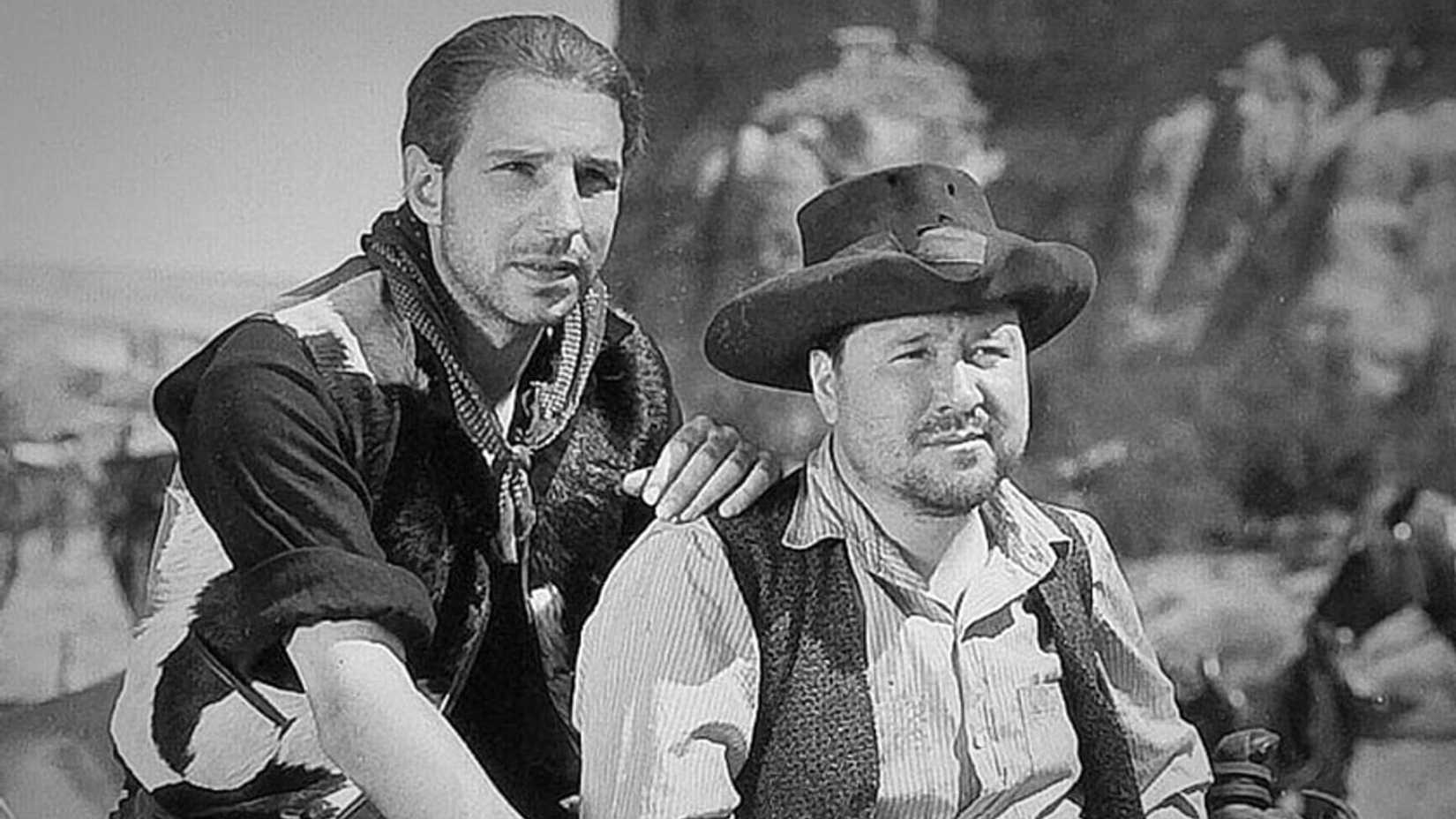 Two men look on in The Texas Rangers