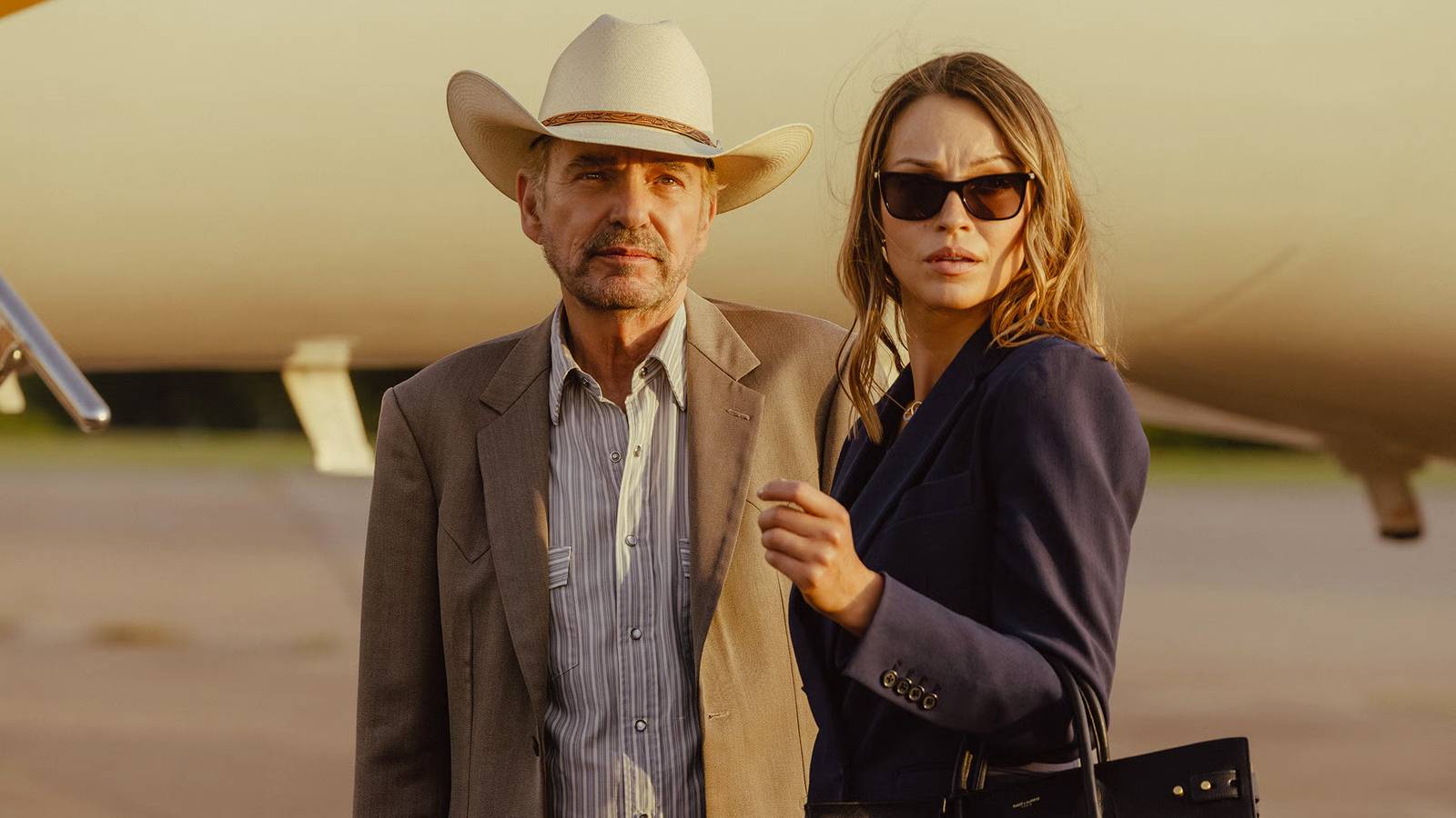Tommy and Rebecca standing together in a still from Landman