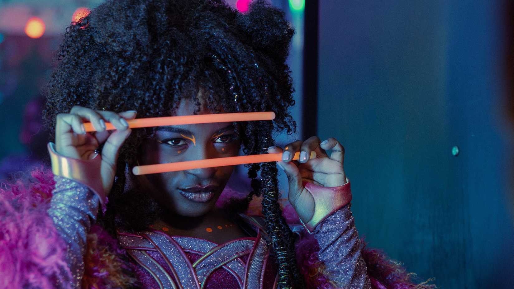 Uhura raving with glowsticks