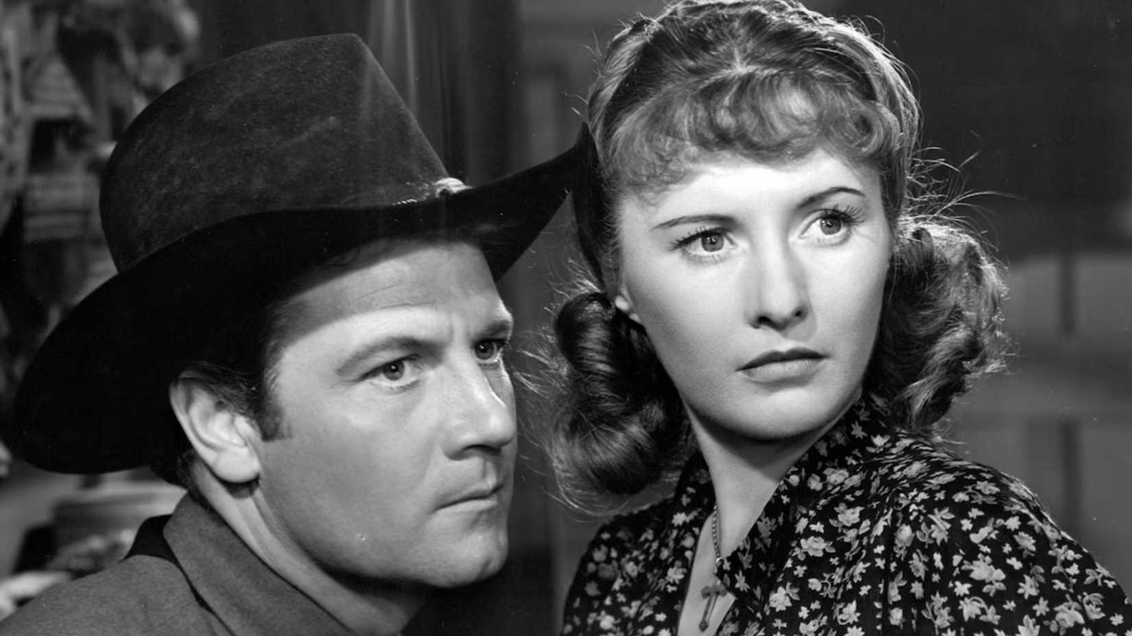 Barbara Stanwyck and Joel McRea look on in Union Pacific