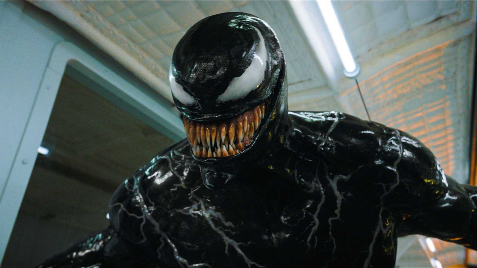 Venom smiling with blood on his teeth in Venom: The Last Dance