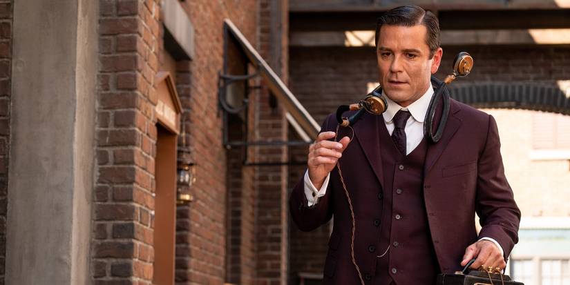 Yannick Bisson as William Murdoch holding a portable phone in Murdoch Mysteries season 14