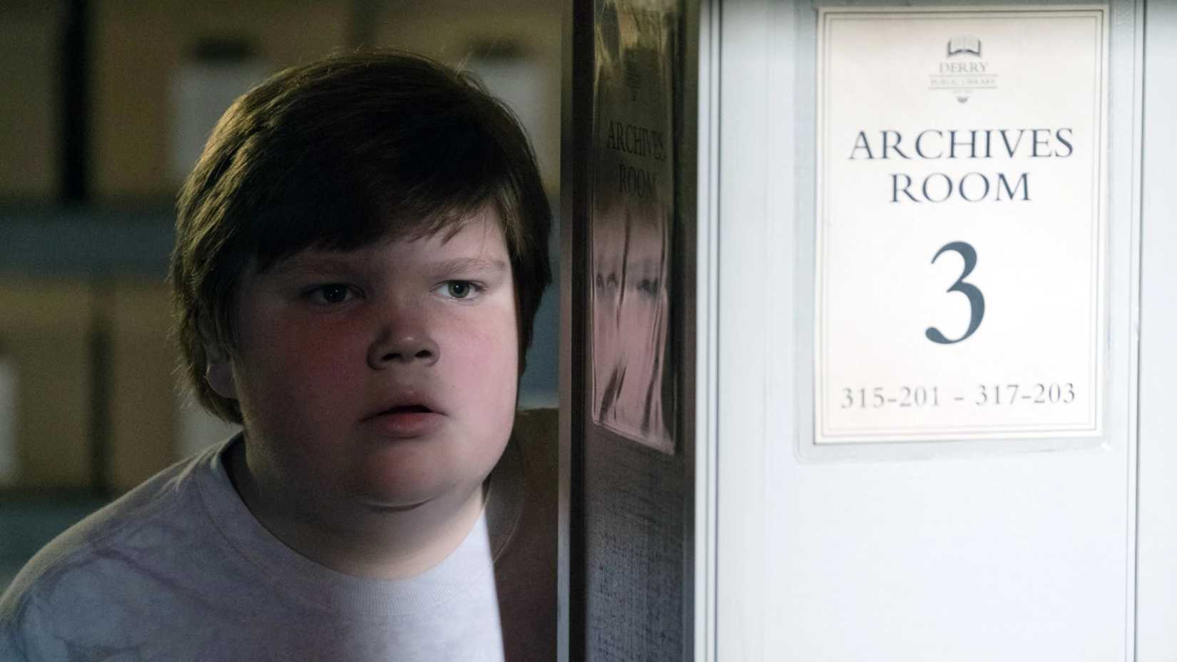 Young Ben Hanscom at the library in It 2017 movie