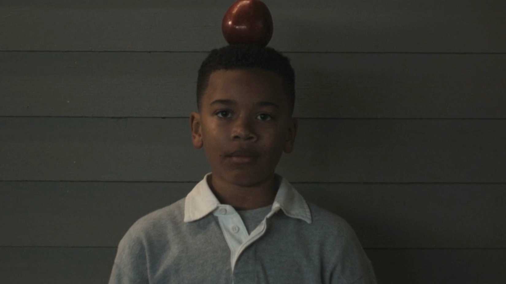 Young John Stewart With Apple On His Head  in Lanterns Episode One