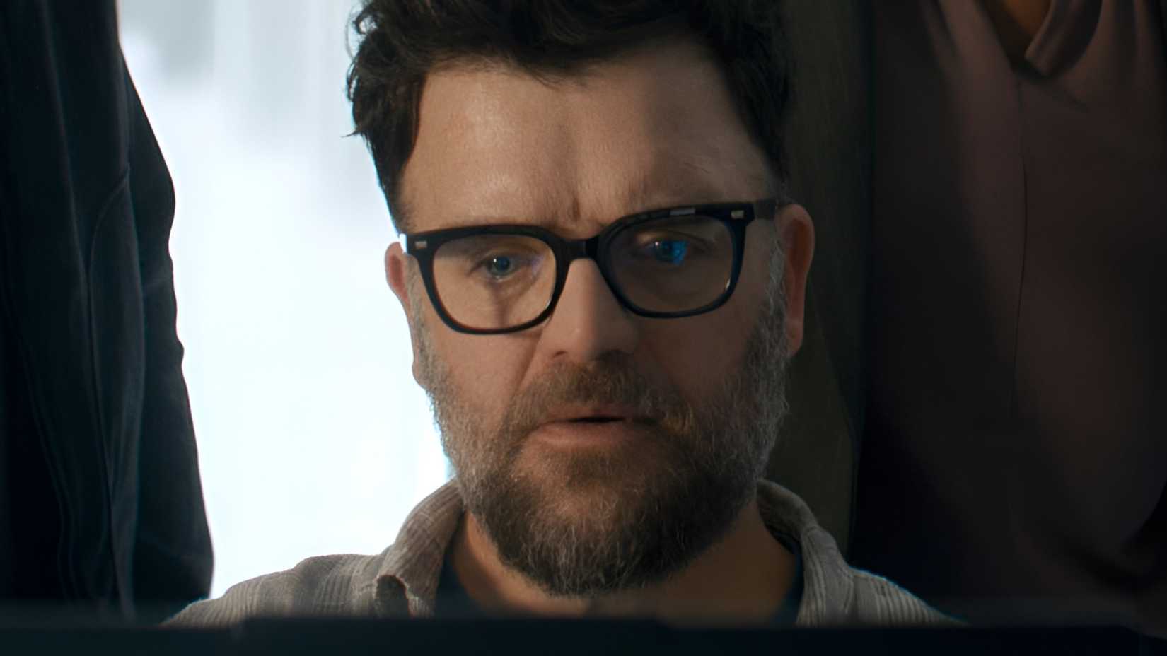Kevin Weisman‘s Russell working on a laptop in Reacher season 4