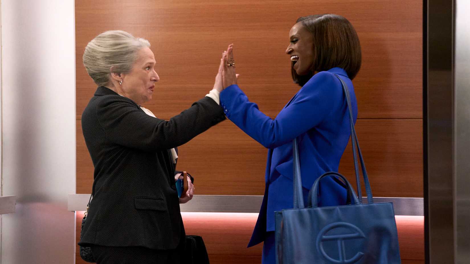 Matty (Kathy Bates) and Olympis (Skye P. Marshall) high-fiving in Matlock