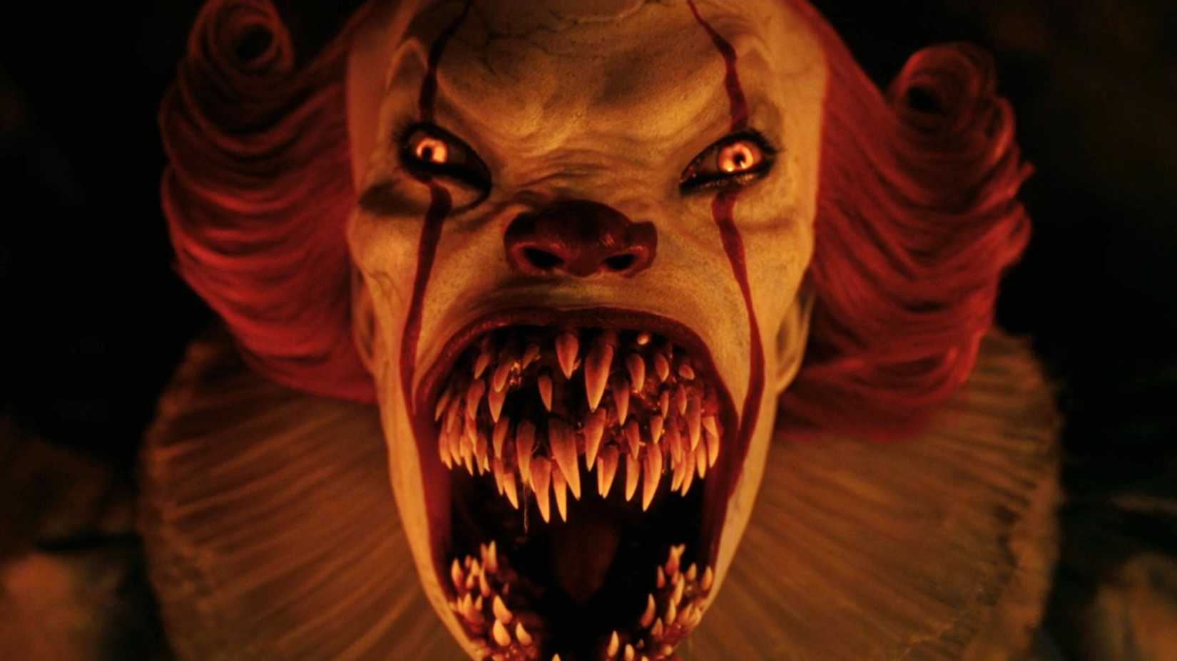 Bill Skarsgård‘s Pennywise with his mouth wide open in It: Welcome to Derry