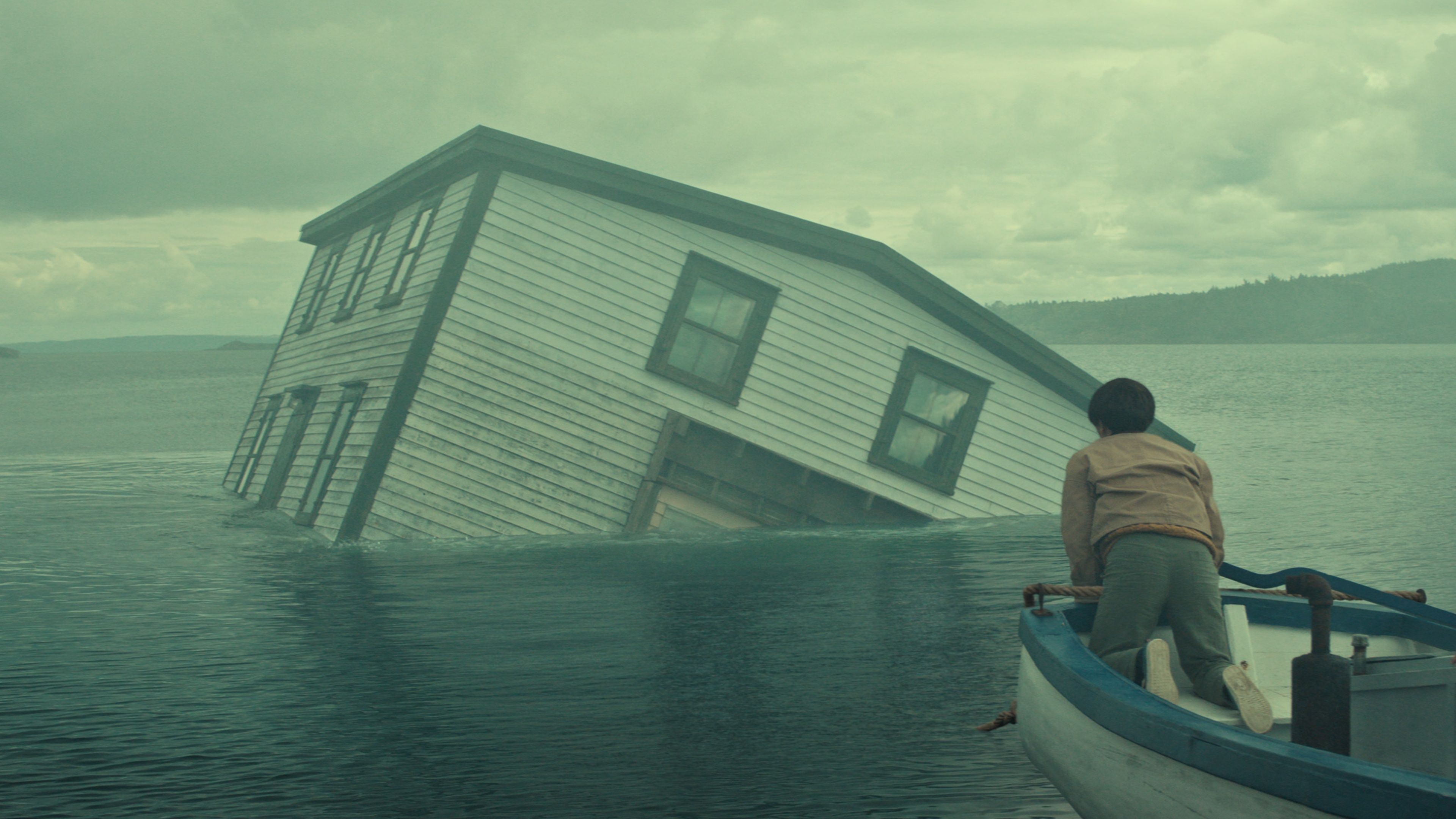 A house being pulled underwater in Below