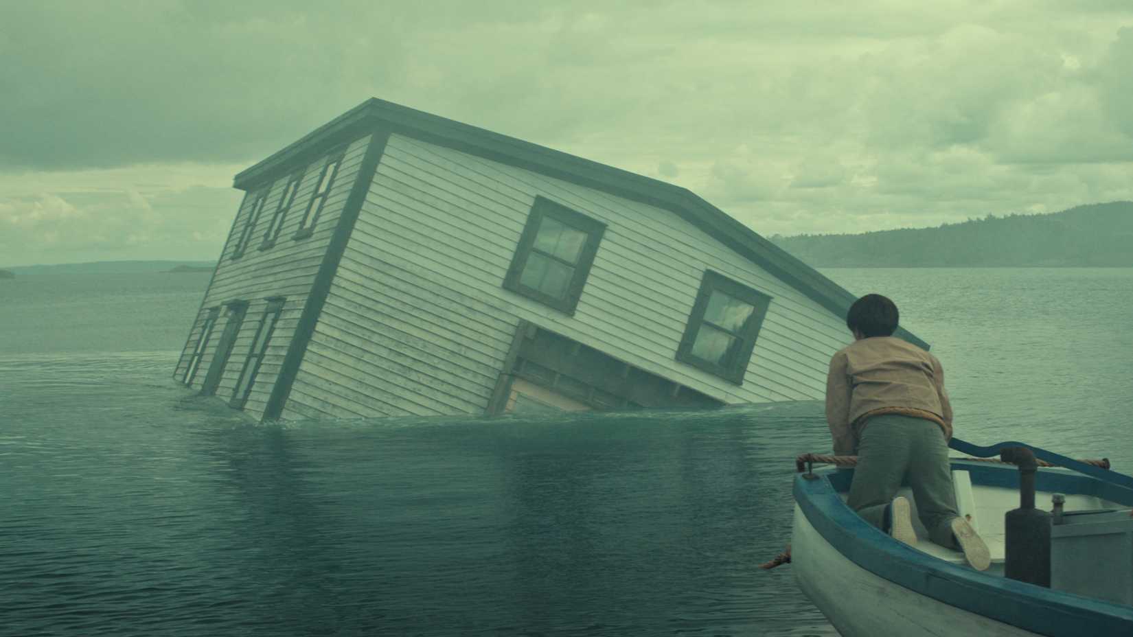 A house being pulled underwater in Below