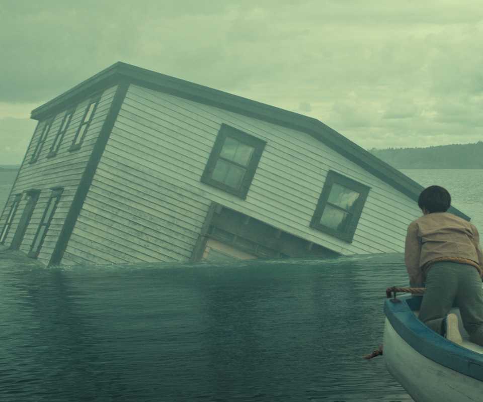 A house being pulled underwater in Below