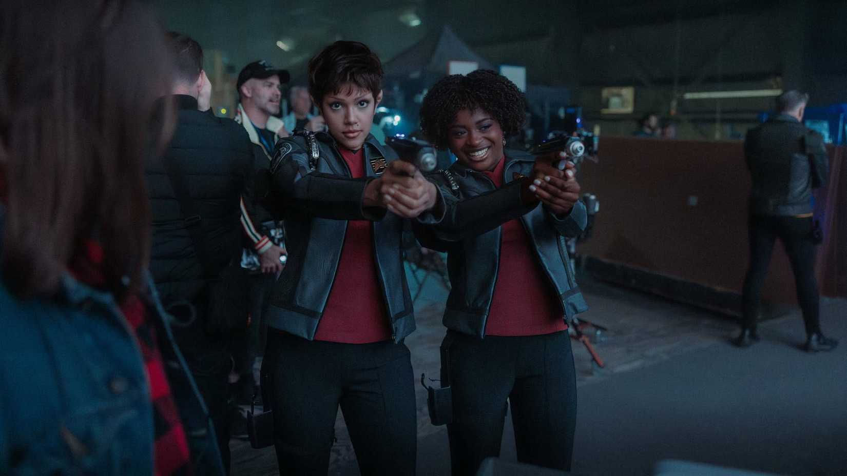 A'Sha and Uhura pointing phasers