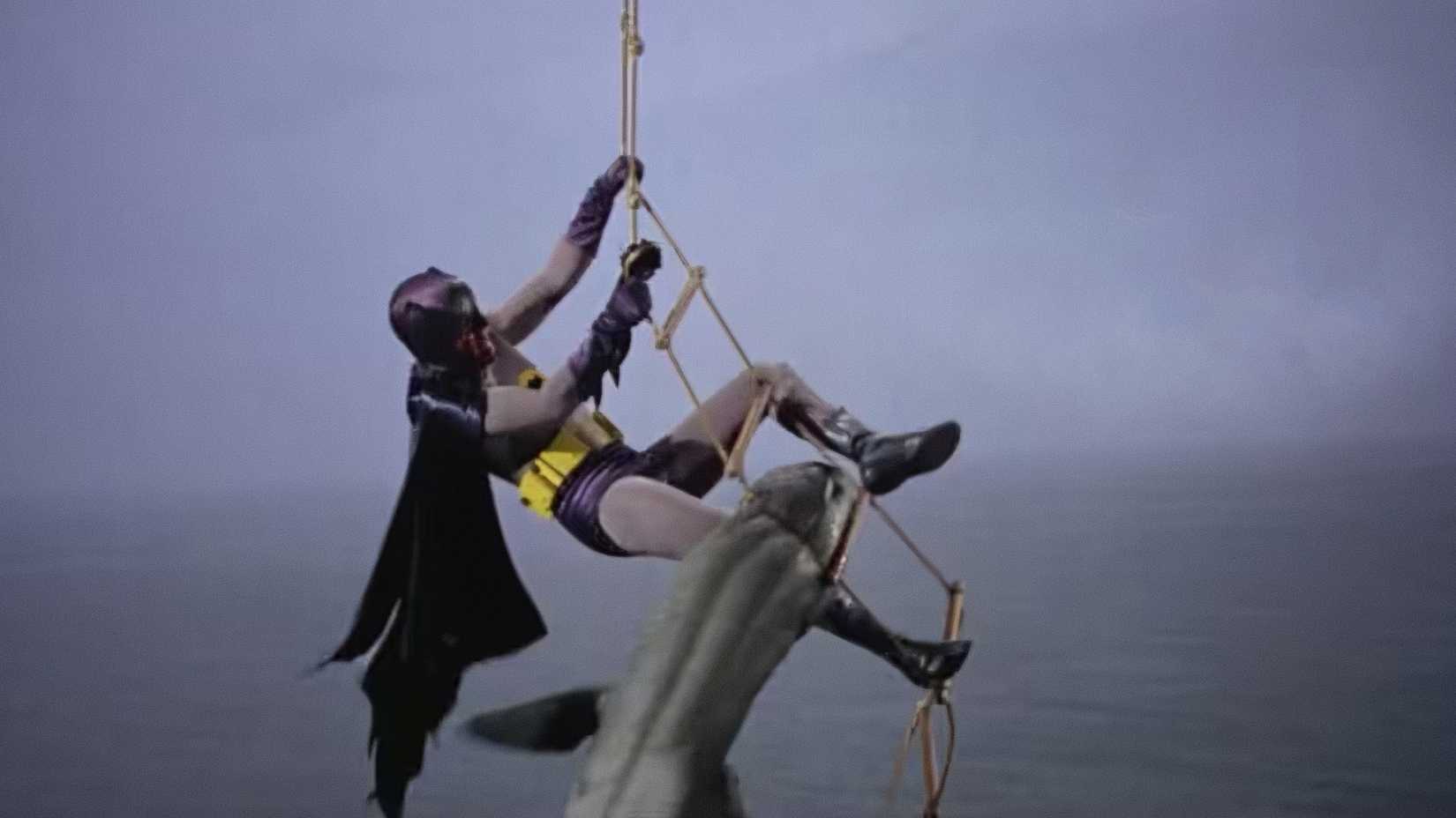 Adam West's Batman fights a shark before pulling out a shark repellent