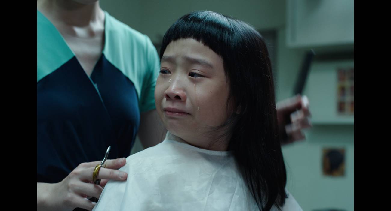 Ah Girl crying while having her hair cut