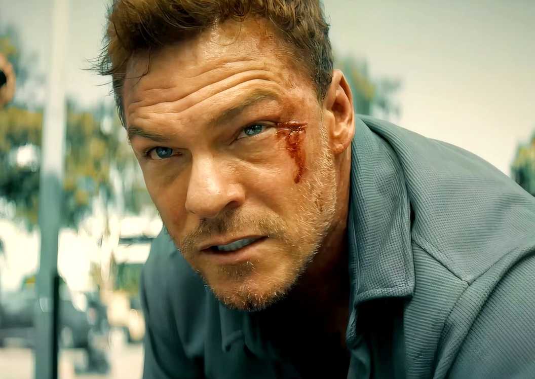 Alan Ritchson with a cut on his face is serious in Runner