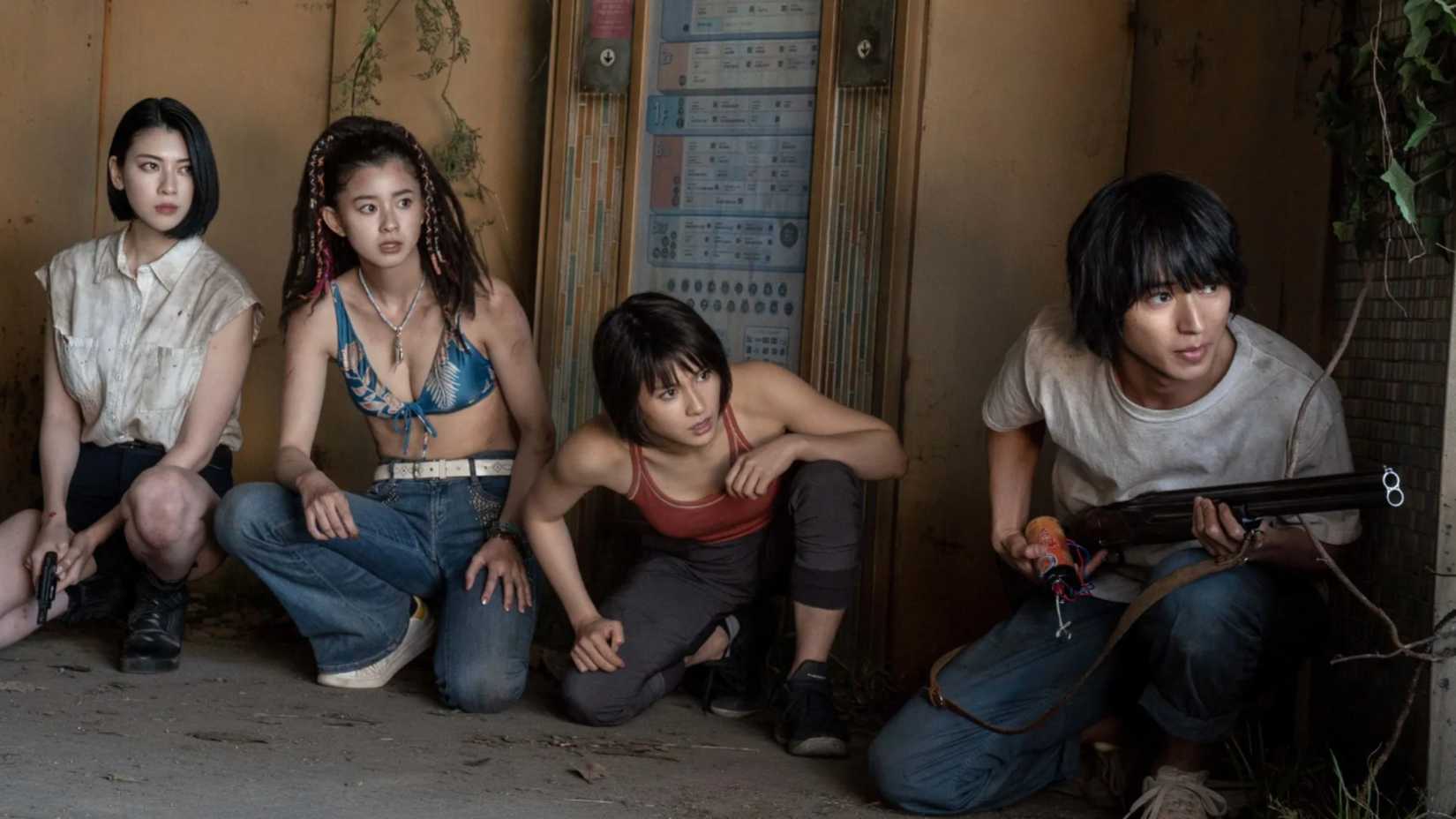 Arisu, Usagi, Kuina, and Ann hides from enemies in Netflix's Alice in Borderland. 