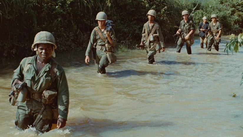 American soldiers walking through a river in Ken Burns' The Vietnam War.
