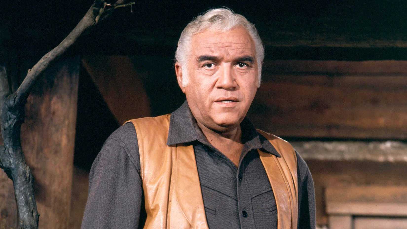 Lorne Greene as Ben Cartwright staring at the camera in Bonanza.