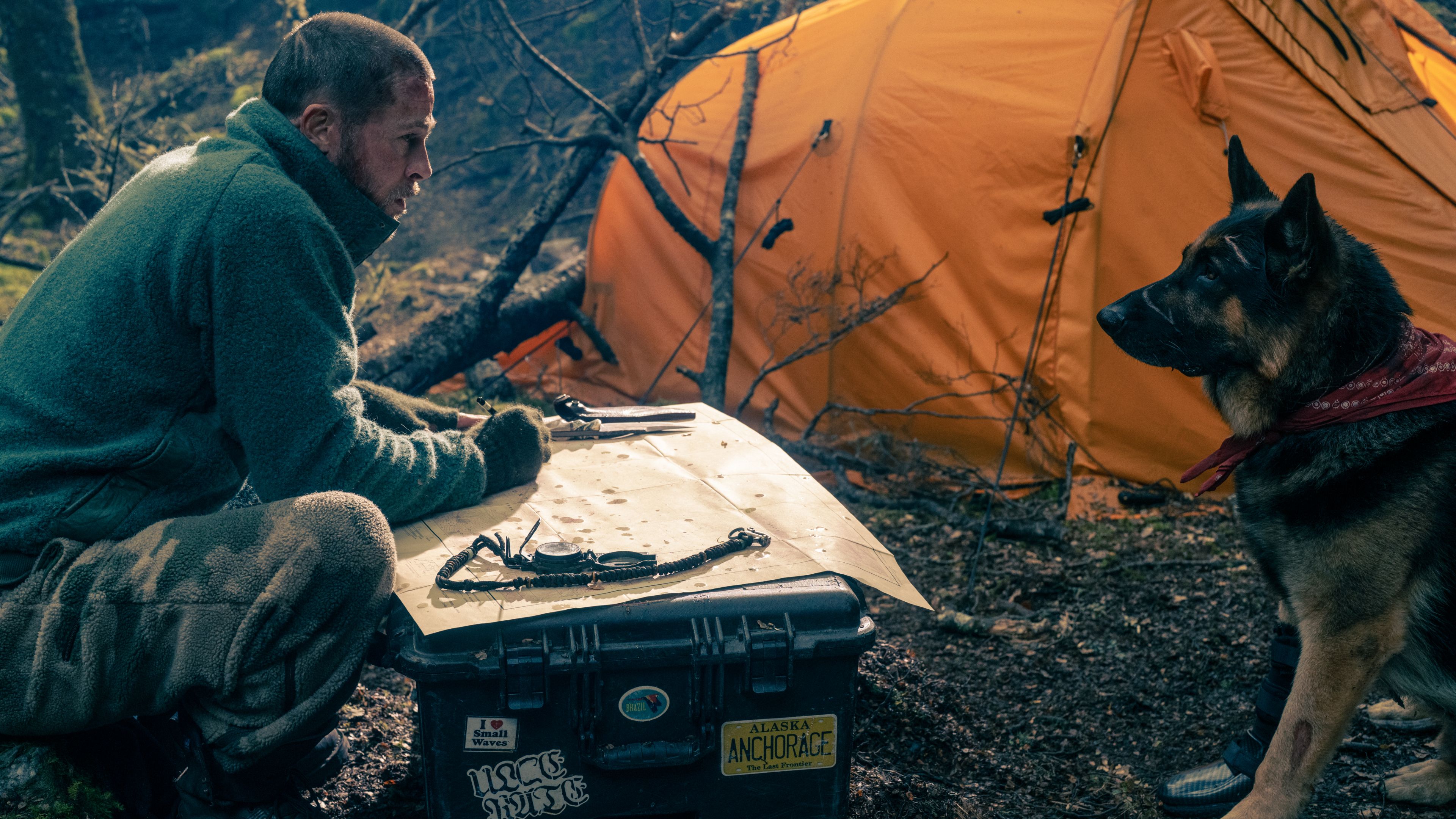 Brad Pitt and Odin huddled over a map in Heart of the Beast