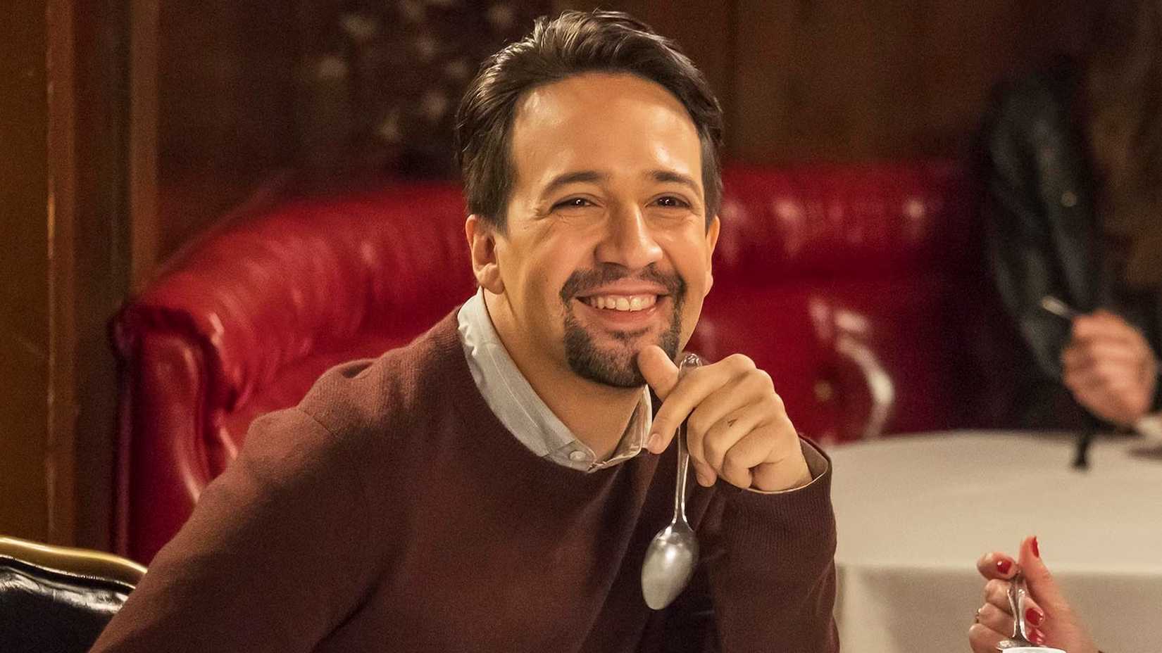 Lin Manual Miranda smiling while eating soup in Brooklyn Nine-Nine.