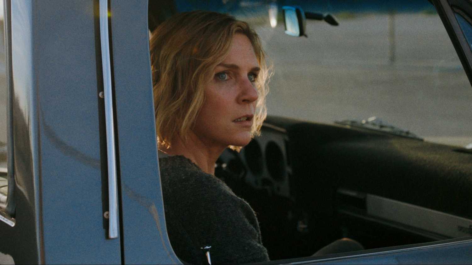 Carol Sturka looks out her car window worried in Pluribus season 1