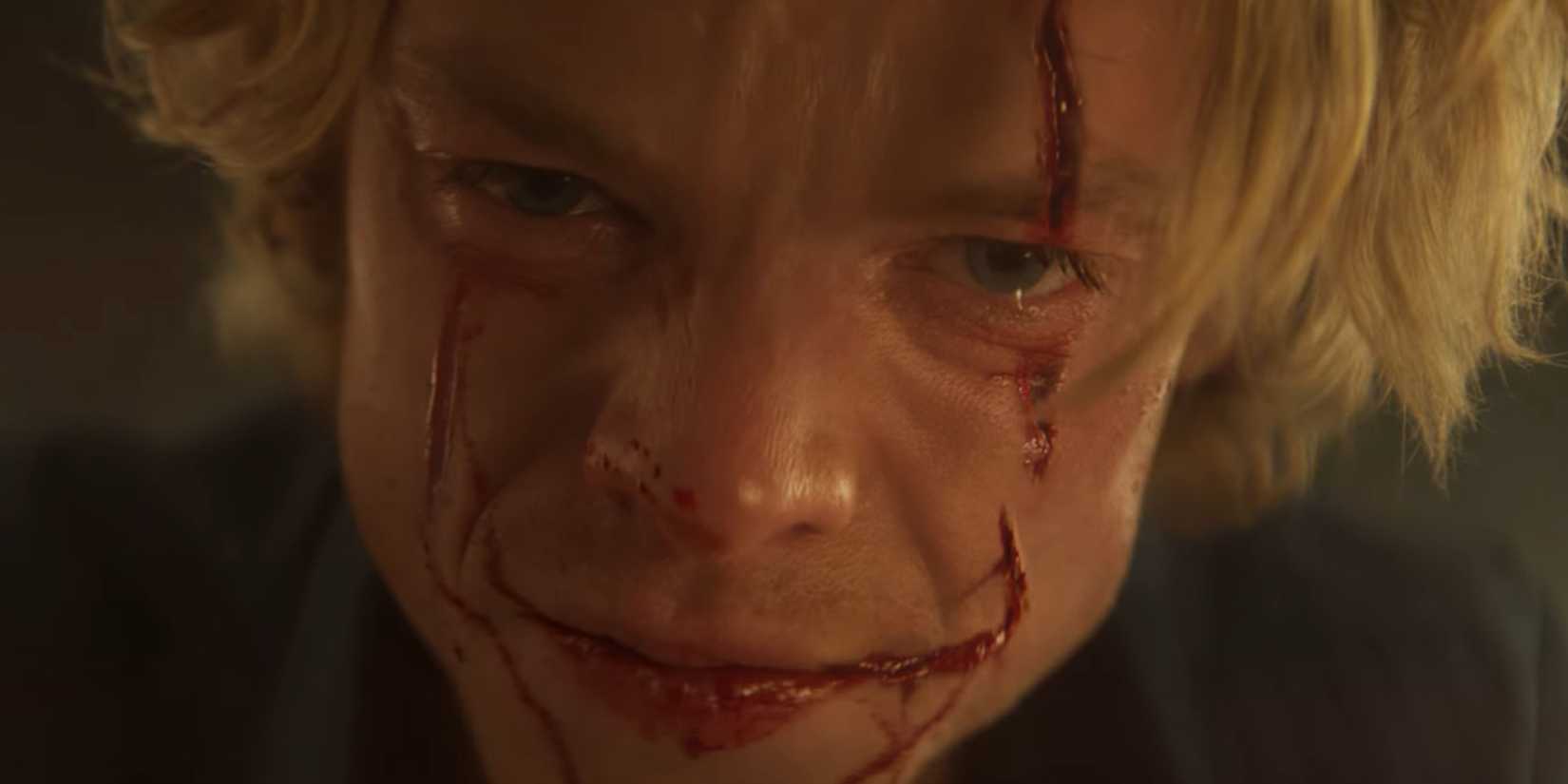 Tom Rhys Harries smiling in Clayface
