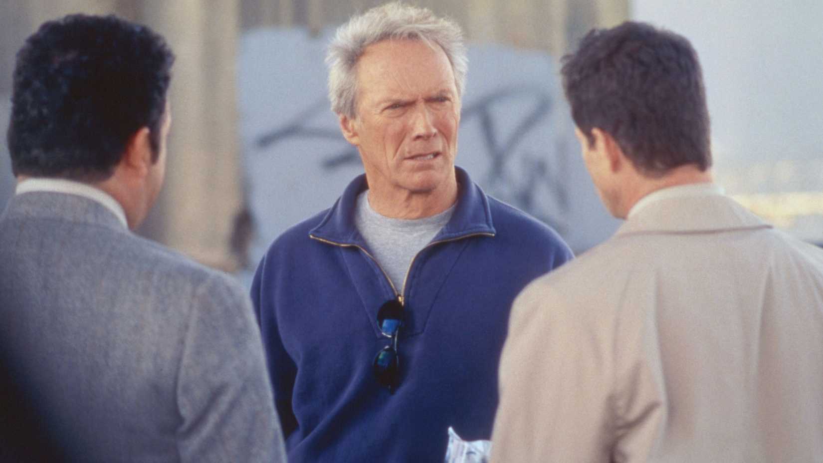 Clint Eastwood talking to two men in Blood Work