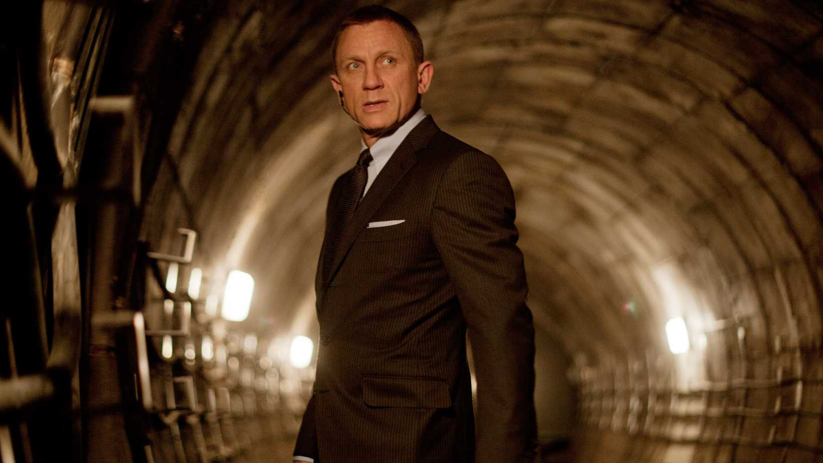 Daniel Craig as James Bond looking frustrated while in a tunnel in Skyfall