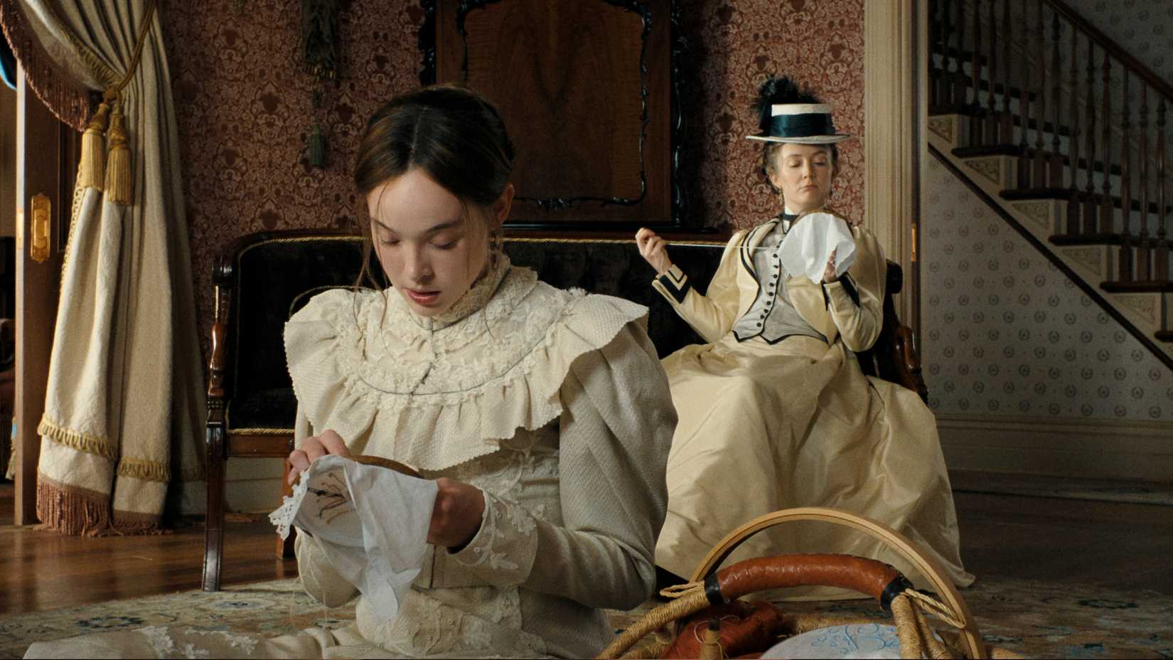 Lizzie Borden and Emma Borden sew in episode 2 of Monster: The Lizzie Borden Story