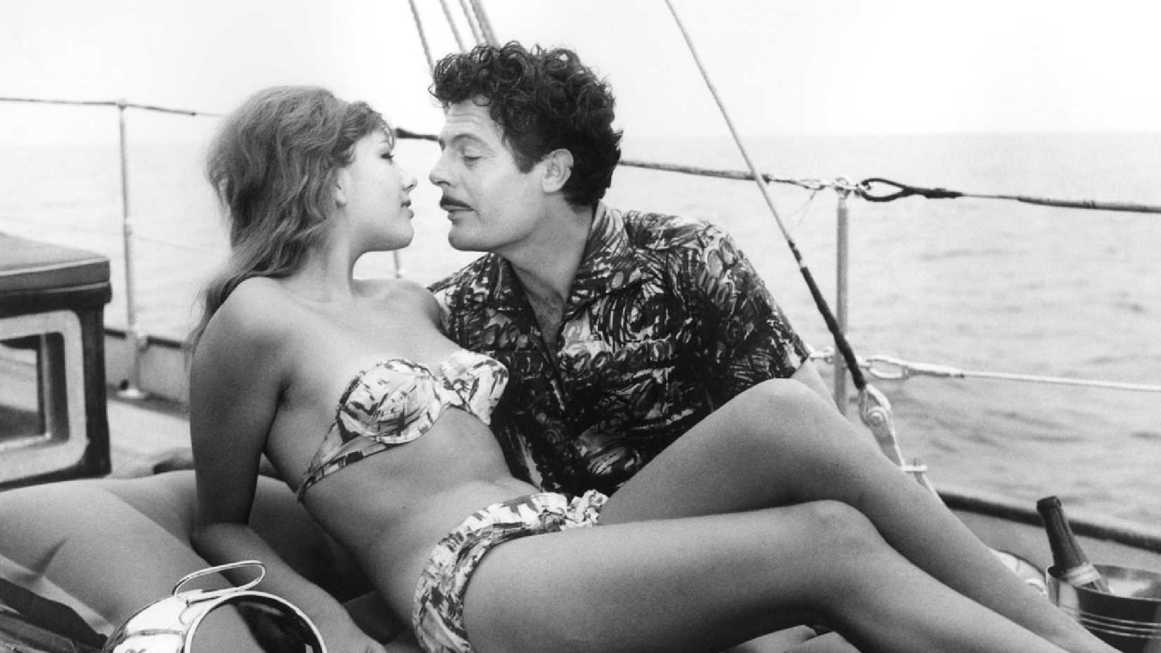 Ferdinando leans toward Angela in Divorce Italian Style